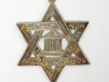 an image of a star of david with a building in the background