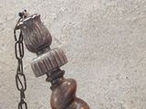 a picture of a wooden object with a chain attached to it