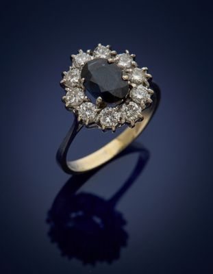a black diamond and diamond cluster ring