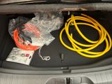 a trunk of a car with a bunch of wires in it