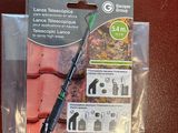a package of items on a table that includes a pen, scissors, and other items