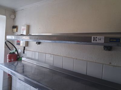 a fire extinguisher sitting on the counter in the kitchen