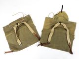 pair of wwii ' s us army canvas backpacks with leather straps