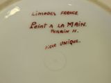 a white plate with a red writing on it