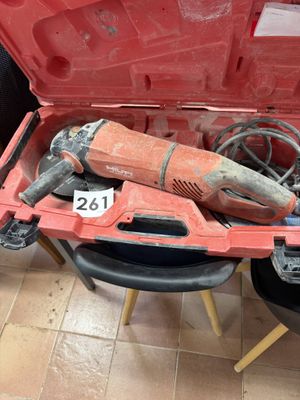 a red tool box with tools in it on the floor