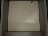 a metal box with a white substance inside of it