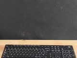 a wooden desk with a keyboard and mouse on it