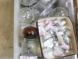 a plastic container filled with assorted items on a table