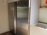 an image of a stainless steel refrigerator in a kitchen
