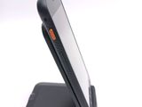 a cell phone that is sitting on top of a stand
