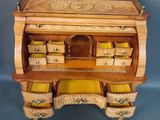 a wooden desk with drawers and drawers on top of it