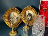 many glass items on the table with pictures on them