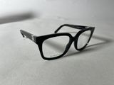 black glasses on a white surface with a white background