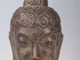 statue of a head of a person with a hat on it ' s head
