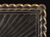 a picture of a glass plate with a gold rim
