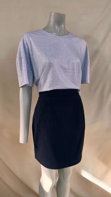 the mannequin is wearing a skirt and a t - shirt