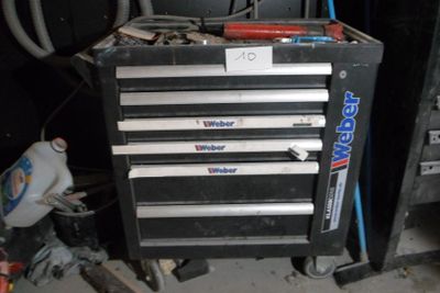 a black tool cabinet that has five drawers on it