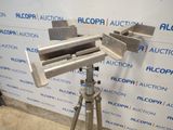 an image of a camera on a tripod in front of a wall