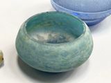two bowls sitting next to each other on a table