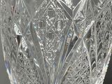 a glass with a pattern on it on a table