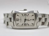 a close up of a wrist watch on a white surface