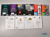 a lot of books that are on the table