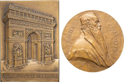 un gros plan sur une médaille d'or sur laquelle figure le portrait d'un homme
