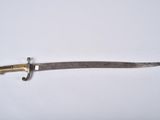 a close up of a knife on a white surface with a white background