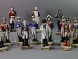 seven figurines of men dressed in military uniforms