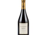 a bottle of wine with a gold cap on a white background