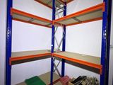 a close up of a shelf in a room with a lot of shelves