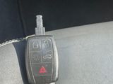 a car key chain attached to a car ' s remote control