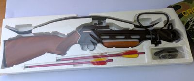 a box with a toy gun and other items in it