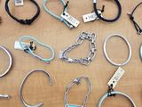 many different types of metal bracelets on a table