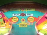 a close up of a pinball machine with a lot of buttons on it