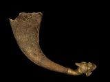 an elephant ' s tusk with a bird on it ' s side