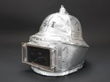 a silver helmet with a window in the middle of it