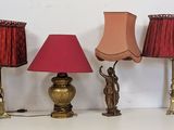 three lamps that are sitting on a white table
