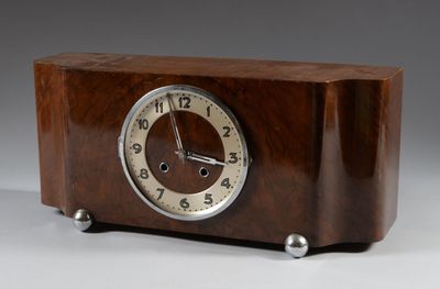a wooden clock that is sitting on a table