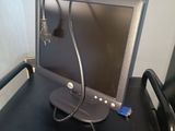 a laptop computer sitting on a desk with a hair dryer on it
