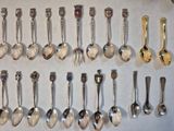 a lot of spoons that are lined up on the table