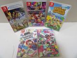 Quatre jeux Nintendo Wii sont posés sur une table