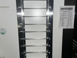 a picture of a wall mounted rack in a kitchen