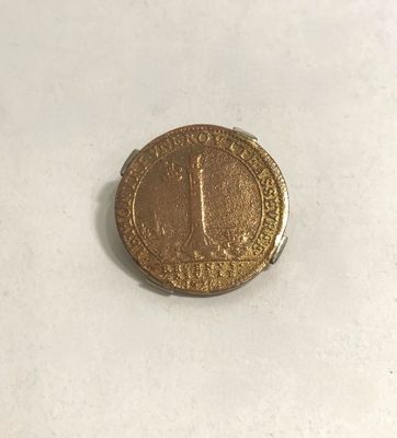 an image of a coin with the number one on it