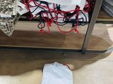 a white bag on the floor next to a bag on the floor