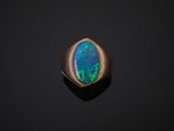 a black oplite ring on a black background