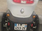 an image of a small car parked in a garage