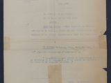 an old document with a piece of paper on top of it
