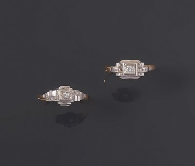a pair of diamond and gold rings