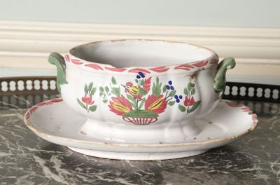 a cup and saucer sitting on a tray on a table